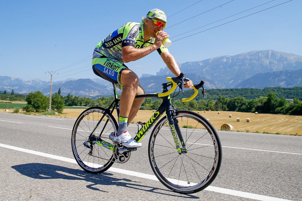 Oleg tinkov rides in the heat on Monday.