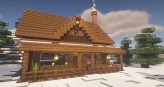 Minecraft cabin build idea - A spruce cabin in a snowy forest with a porch and chimney.