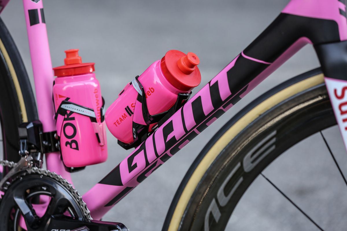 Custom pink bidons and bidon cages complement the look
