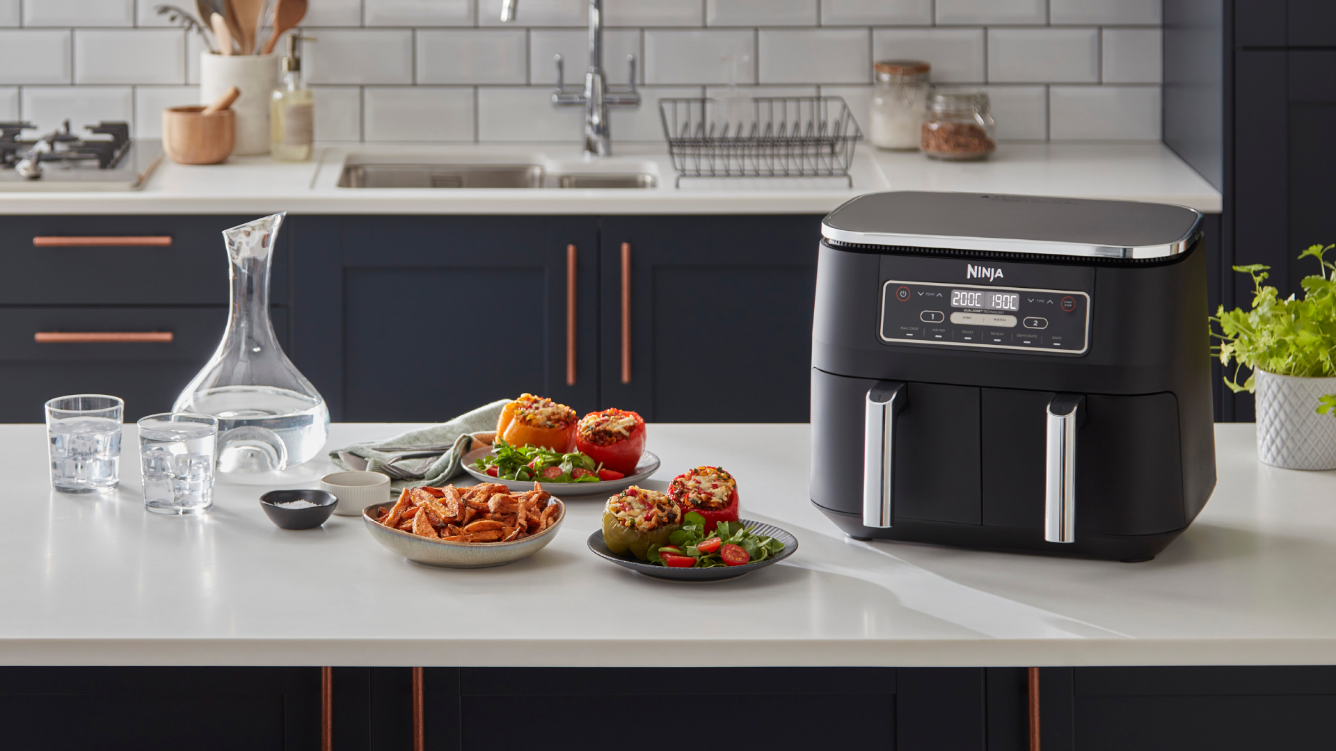 Ninja air fryer on white countertop in blue kitchen