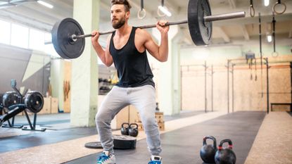 Man lifting weights at the gym