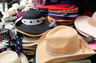 Straw hats stacked up for sale
