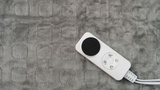 aerial view of an electric blanket with controller