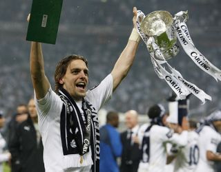 Tottenham’s match-winner Jonathan Woodgate celebrates with the Carling Cup