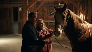 Doc and Hope stroking a horse in Virgin River season 6.