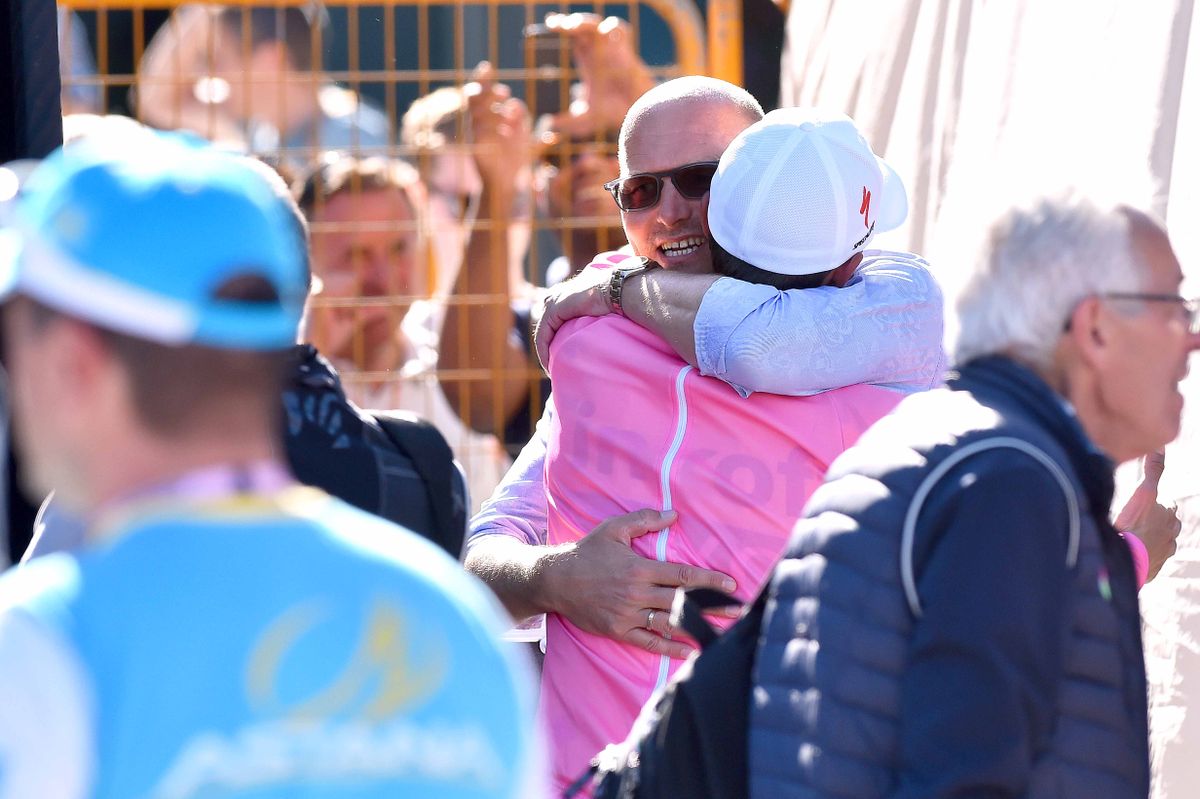 A hug for Alberto Contador and Bjarne Riis after the stage