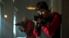 Netflix Money Heist guns red jump suits