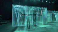 Maze made up of translucennt plastic sheets with cyber slogan "Don't get exposed" printed on it