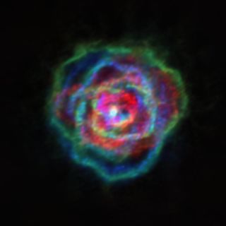Stellar winds from the star R Aquilae form a number of shapes, coming together to resemble flower petals. This image was captured by the Atacama Large Millimeter/submillimeter array in Chile as part of the ATOMIUM project.