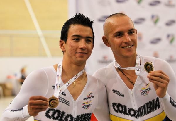 Juan Arango and Weimar Roldan show off their Madison gold medals