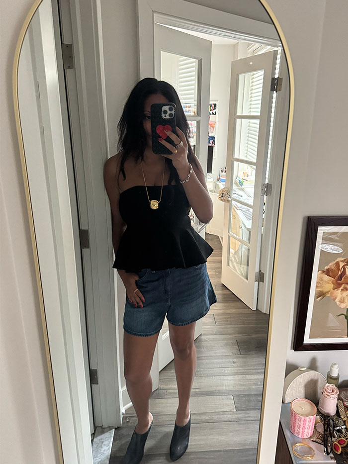 Sierra Mayhew wearing denim shorts.