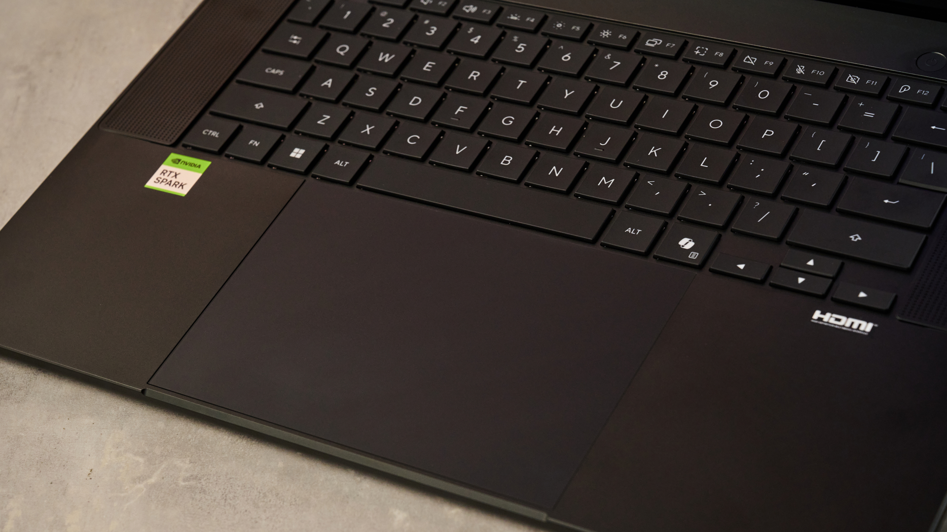 A closeup of the Asus ProArt P16 RTX Spark's keyboard and trackpad.