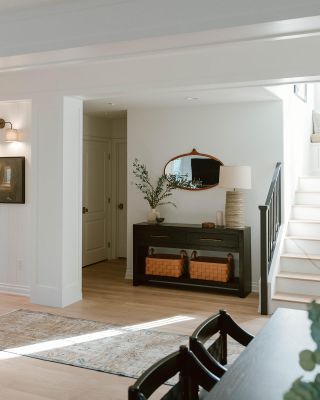 Entryway with console table and stairway