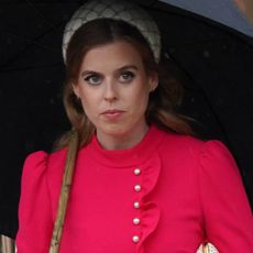 Princess Beatrice in a pink dress and headband contrasting with her casual outfit for work in London