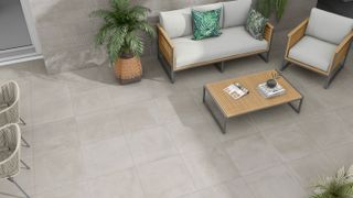 pale grey porcelain tile paving with outdoor furniture