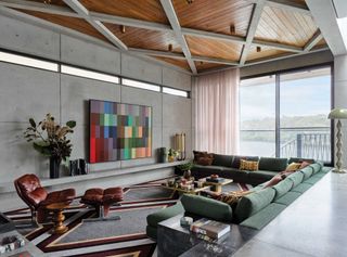 a brutalist living room with colorful finishings