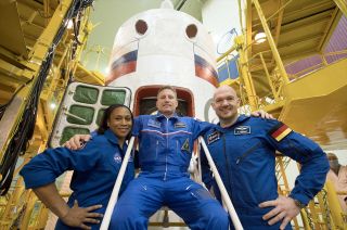 Jeanette Epps, seen with her former crewmates Sergey Prokopyev (at center) and Alexander Gerst in December 2017 at the Baikonur Cosmodrome in Kazakhstan.