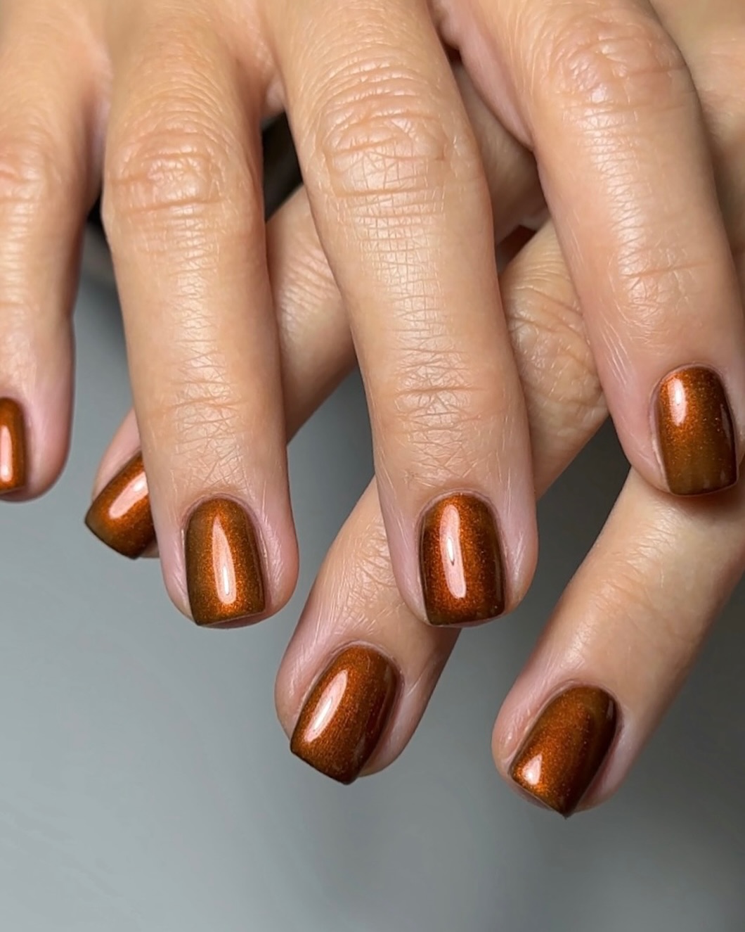 a metallic brown manicure