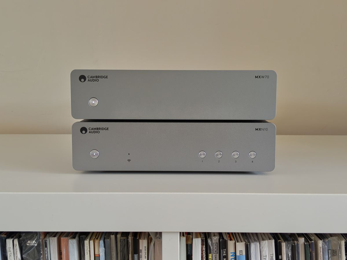 Cambridge Audio MXW70 power amp on book shelf with streamer