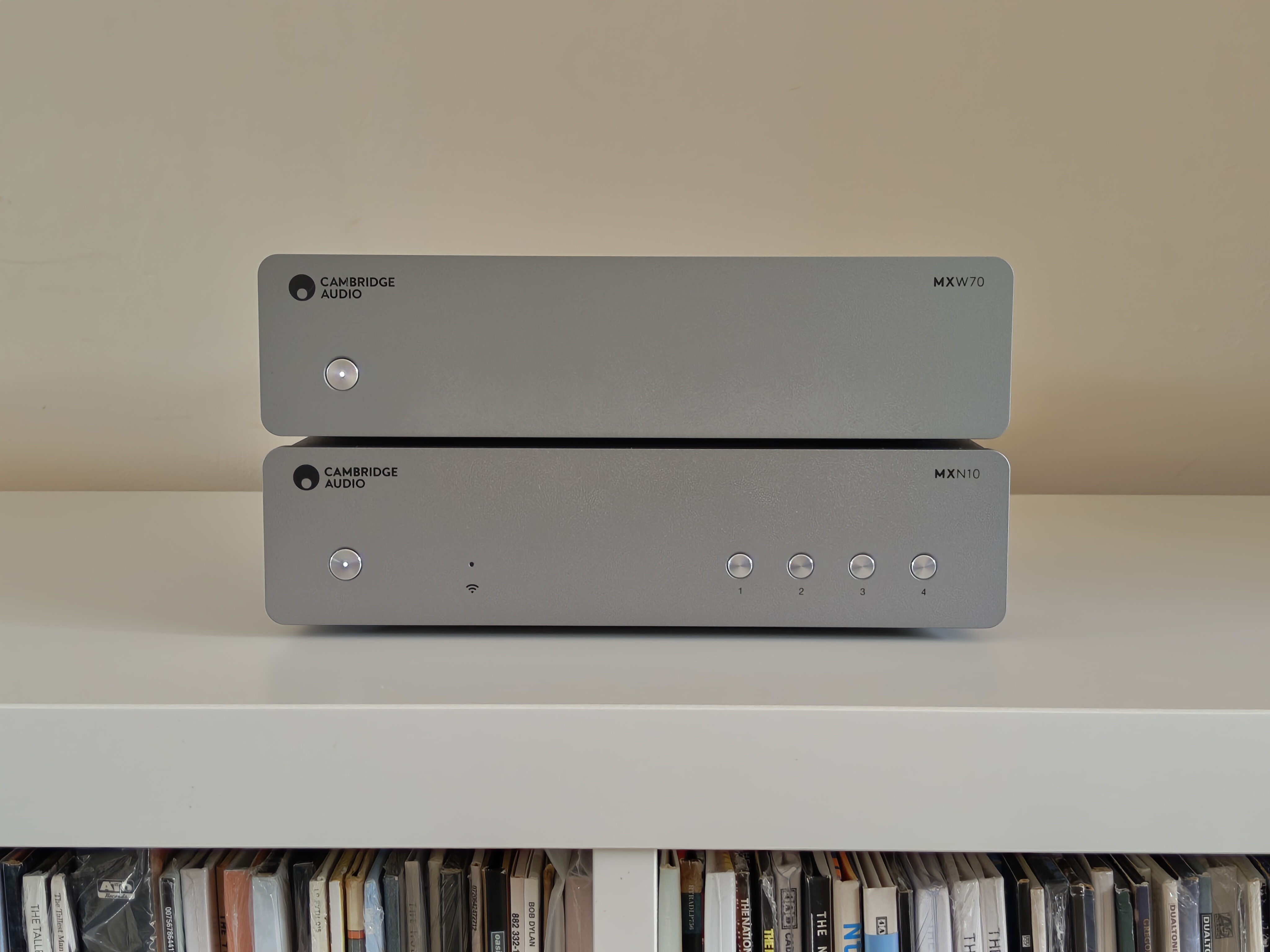 Cambridge Audio MXW70 power amp on book shelf with streamer