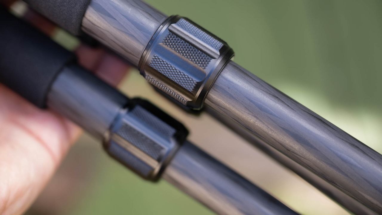 ZWO Seestar S50 Pro on a tripod against a green shed