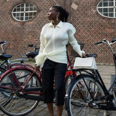 An image of @daniellejinadu wearing one of the best Scandi fashion brands.