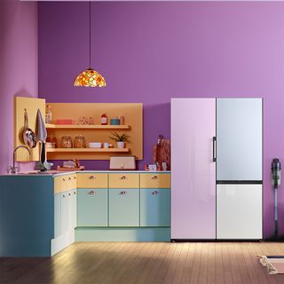 samsung bespoke fridge freezer in a purple kitchen with green and yellow cabinets
