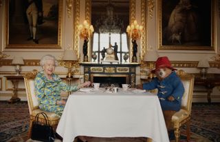 Queen Elizabeth II having tea with Paddington Bear for the Platinum Jubilee