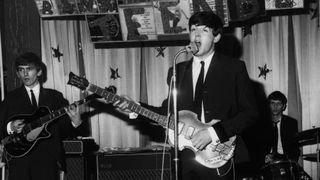 The Beatles perform at The Majestic Ballroom on April 10, 1963 in Birkenhead, England. (from left) George Harrison, Paul McCartney and Ringo Starr. John Lennon is to the right off camera. 