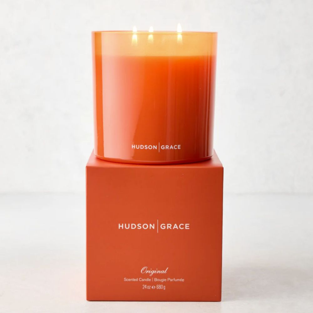 Orange candle on top of the candle box