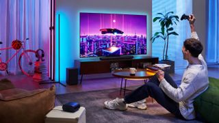 TCL C805 lifestyle image with gaming on TV display in living room