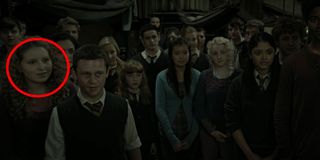 Tons of Harry Potter characters inside the Room of Requirement including Lavender Brown who is circled.