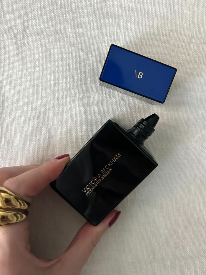 Deputy beauty editor Grace Lindsay holding the Victoria Beckham by Augustinus Bader The Foundation Drops with TFC8&amp;reg;