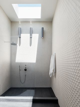 White bathroom with skylight at Four One Nine by Síol Studios