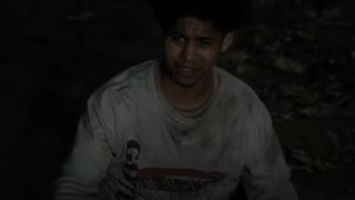 Rhenzy Feliz as Victor, standing in a grave on The Penguin