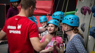 Young climbers learning the ropes at Urban Uprising