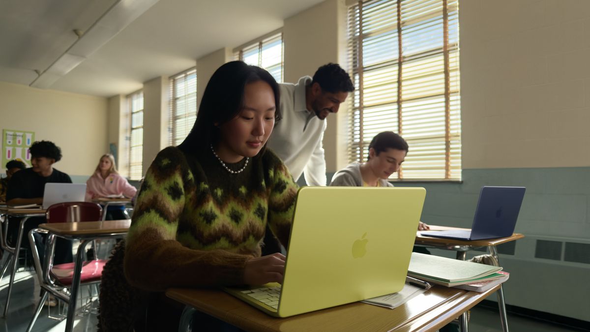 Apple MacBook Neo being used by a young woman in a classroom
