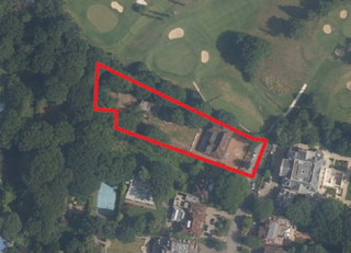 A birds eye view of the plot with a red line draw onto it highlighting the boundary