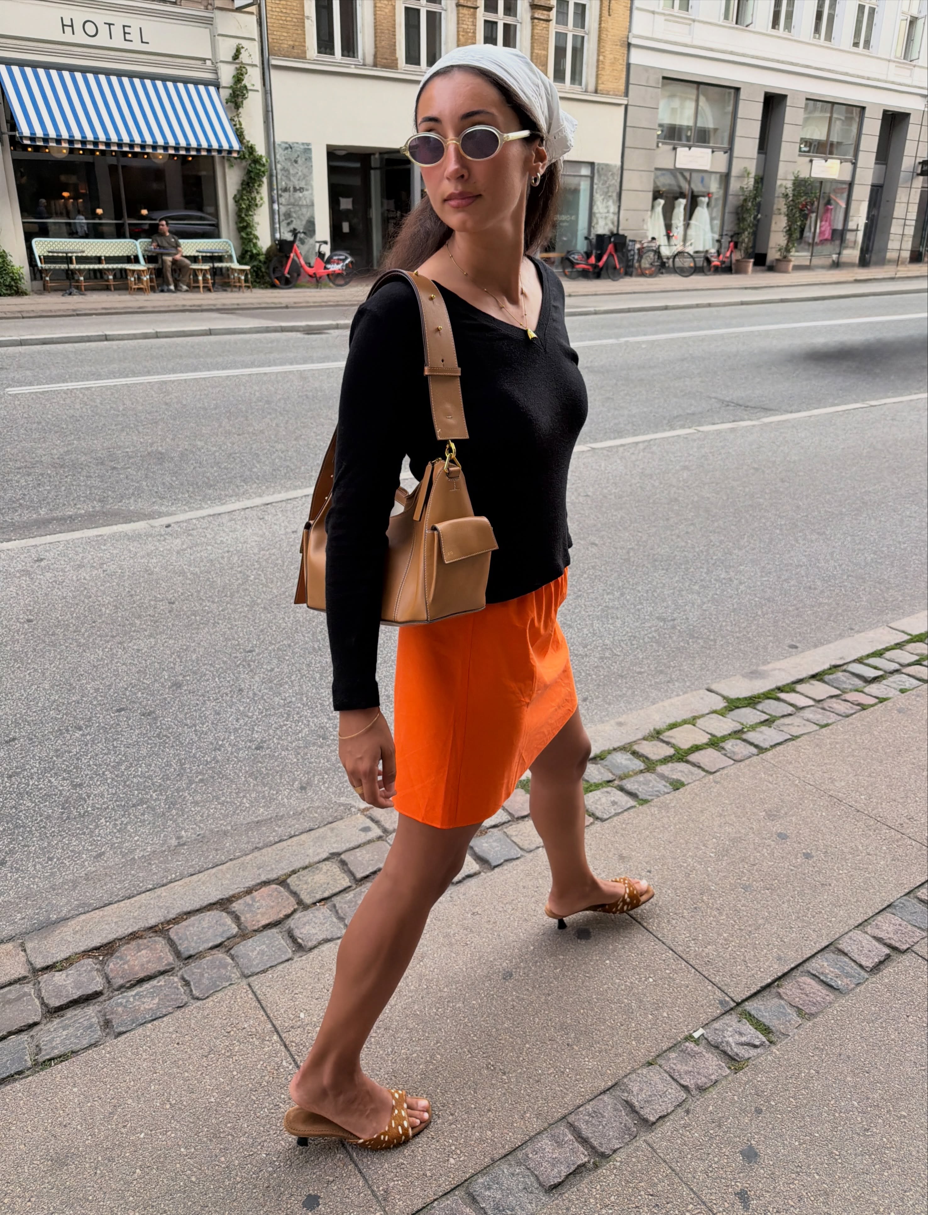 An image of a woman wearing early fall trendy outfit idea 2026