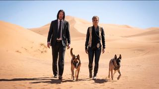 Keaunu Reeves, Halle Berry and 2 dogs walking in the desert