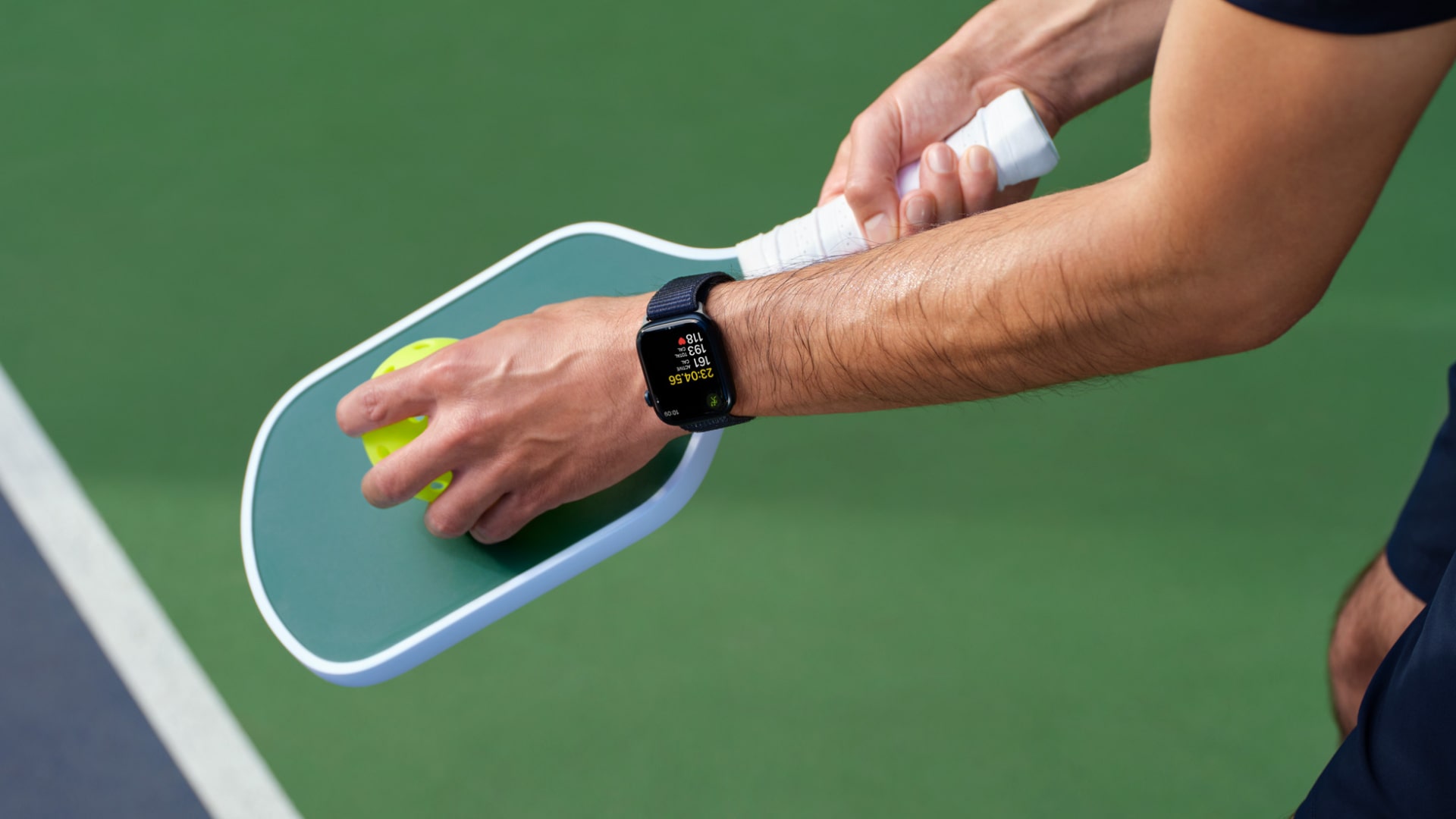 A person tracks a pickleball workout on an Apple Watch.
