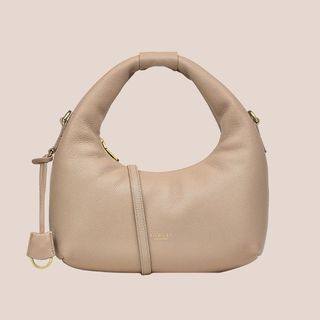 flat lay small beige handbag