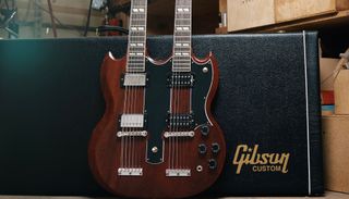 Gibson's Custom Shop VOS Jimmy Page EDS-1275 guitar, leaned up against a Gibson Custom hardshell case