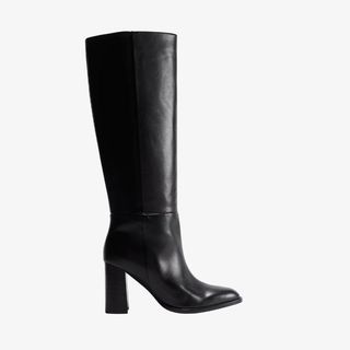 flat lay image of knee high leather boots