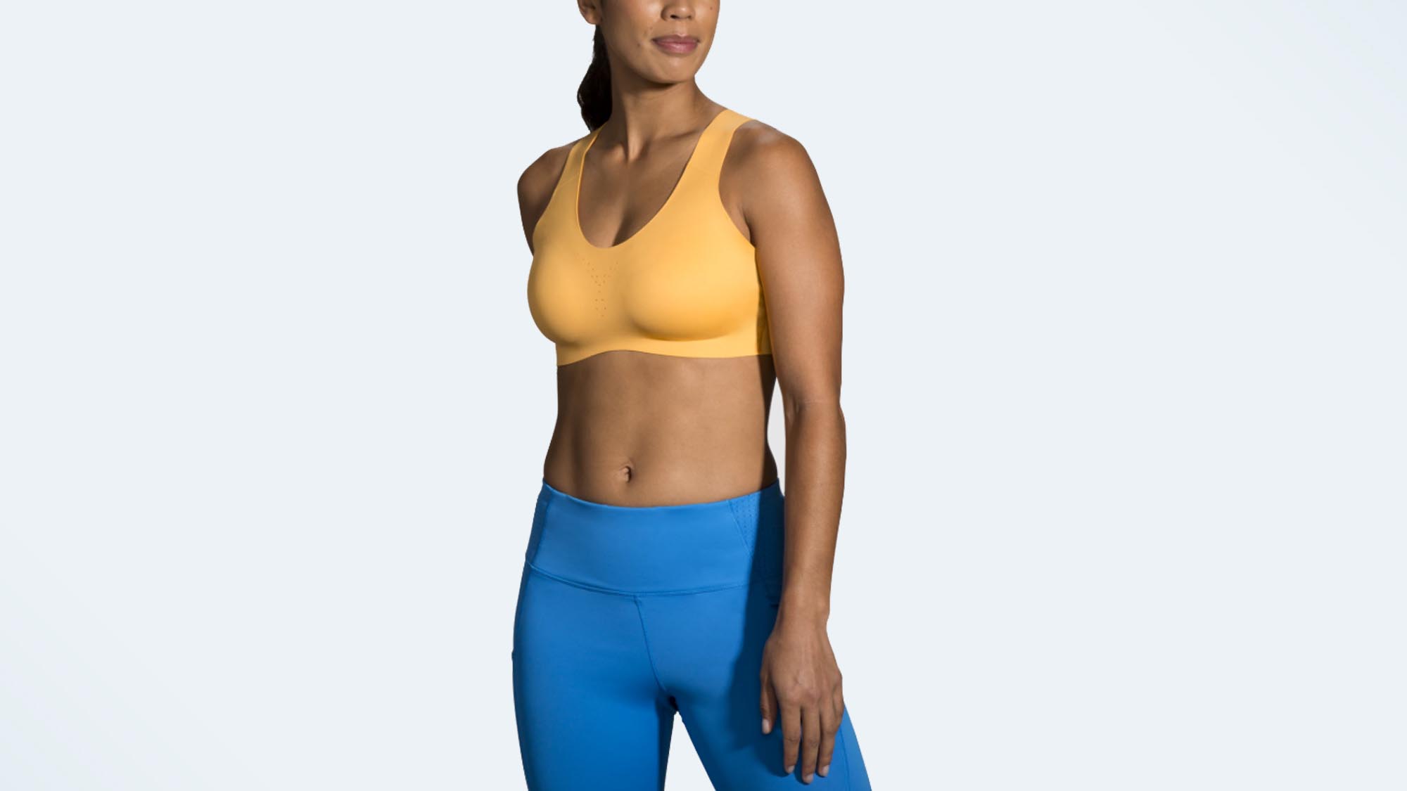 A photo of a woman wearing the Brooks Dare Crossback sports bra, one of the best high-impact sports bras