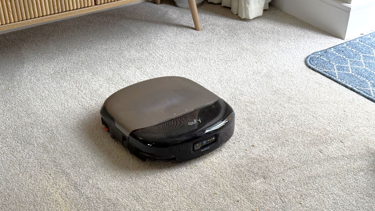 Eufy Omni S2 robot vacuum cleaning a carpeted floor
