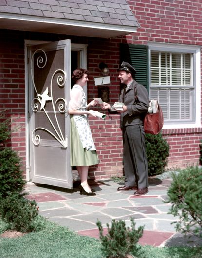 A postman delivering mail.
