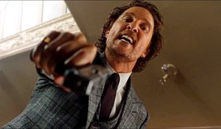 The Gentlemen Matthew McConaughey angrily aims his gun down at the camera