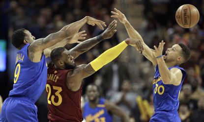 Cleveland Cavaliers' LeBron James, Golden State Warriors' Stephen Curry (30), and Warriors' Andre Iguodala.