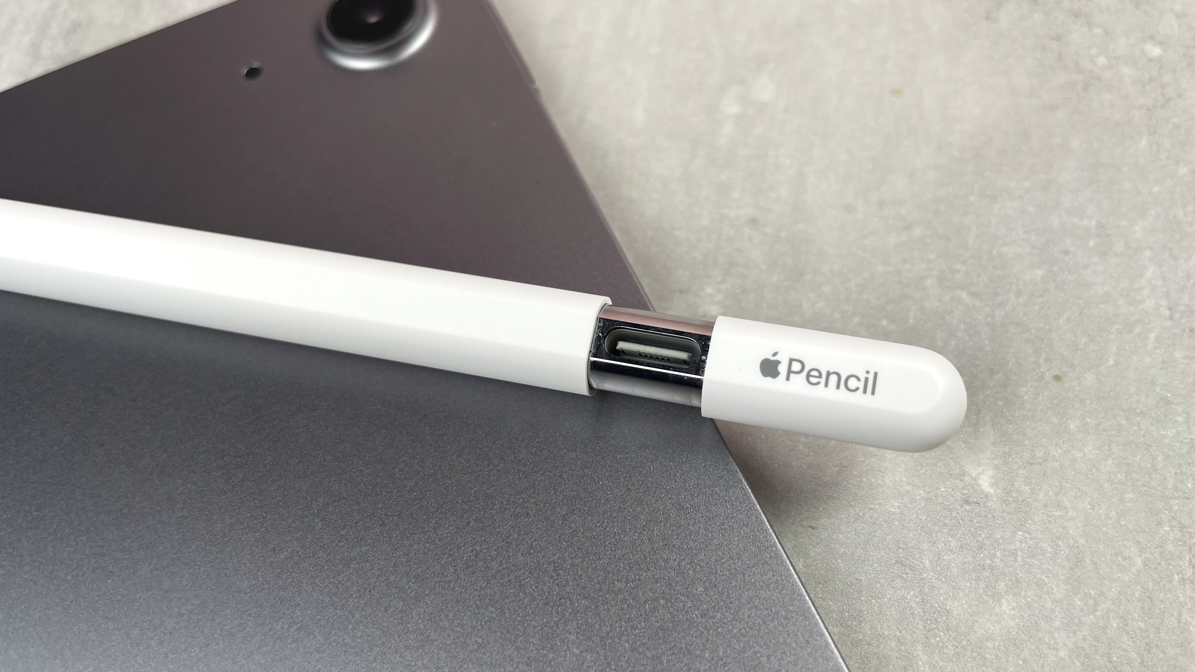 A close-up of the hidden charging port on the Apple Pencil USB-C